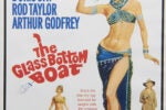 Poster for The Glass Bottom Boat (1966) starring Doris Day, Rod Taylor, Arthur Godfrey, and featuring Doris Day in a blue costume holding a harpoon gun