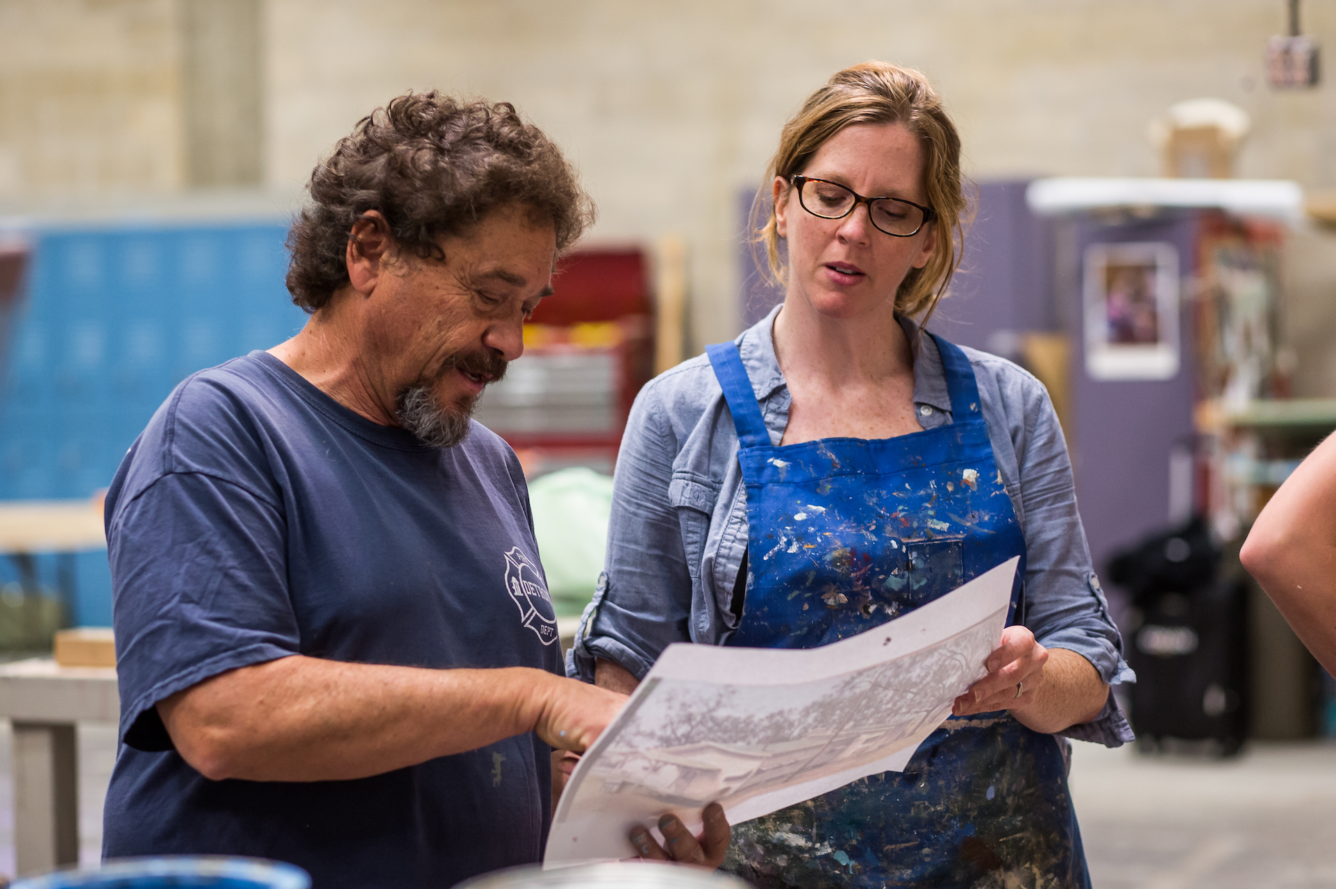 Michael Denering working with UT Austin faculty Karen Maness during the 2015 Texas Performing Arts Hollywood Backdrop painting master class